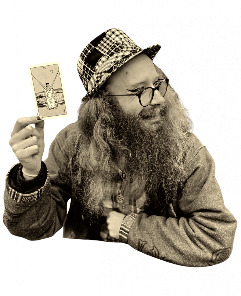 Gord holding a tarot card. Tarot reading in manchester