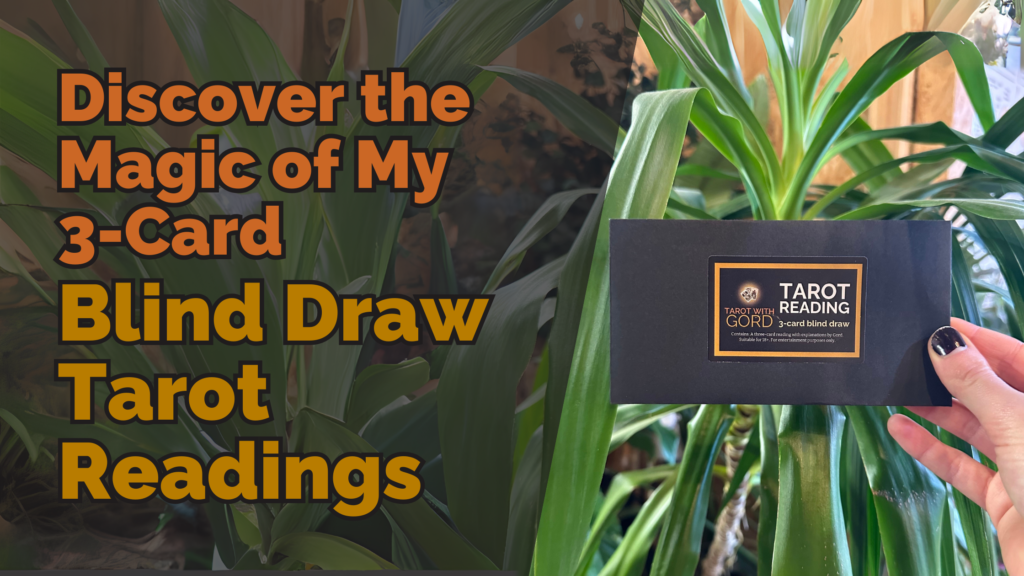 Black envelope labelled ‘tarot reading - 3-card blind draw’ held in front of lush green plants, with the text ‘discover the magic of my 3-card blind draw tarot readings’ displayed in bold orange and yellow letters.