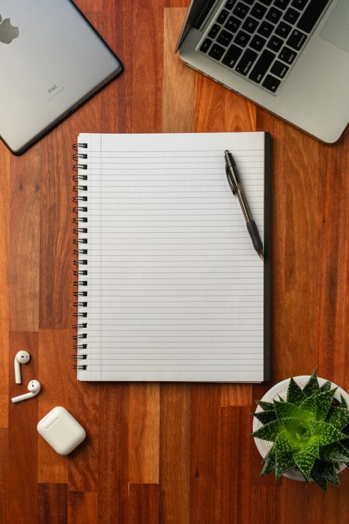 Black pen on white notebook, which could be used for tarot readings.